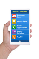 Hand holding smartphone showing health care contact menu on screen.