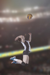 Female volleyball players jumping close-up on vollayball court.