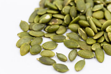 Pumpkin seeds on white background