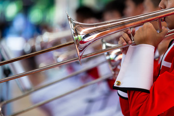 Play Musical instruments  in Marching band