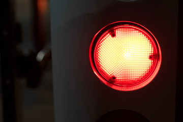Red emergency light glows in dark close