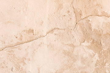 An old crumbling cement wall . Background texture of old wall