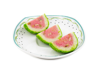 Indian Sweet Food Watermelon shaped Mawa Burfi isolated on white background