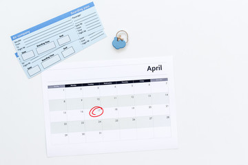 Plan a trip. Buy airplane tickets. Tickets near calendar with date circled on white background top view copy space