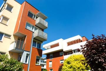 Exterior of a modern  apartment buildings on a blue sky background.