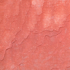 Red rough stone texture background. Material construction and architectural detail.