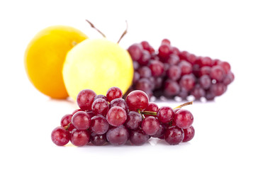 Red grape with leaf isolated on white background
