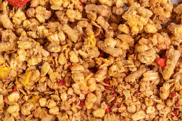 Homemade roasted granola on baking sheet breakfast food background
