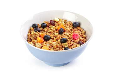 Bowl of homemade granola with fruit pieces isolated on white