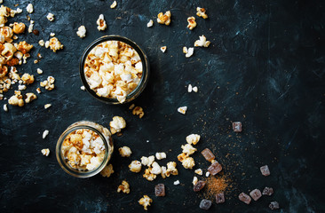Caramel sweet popcorn, dark background, top view
