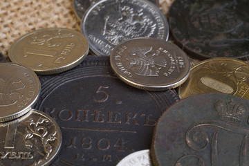 old and new coins of russia for comparison of magnitude, copper and iron round coins