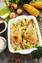 Chicken legs baked with rice and vegetables