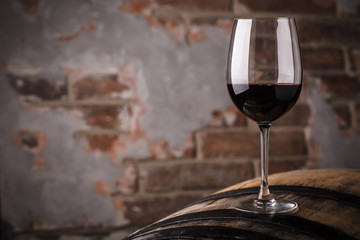 Red wine on a barrel