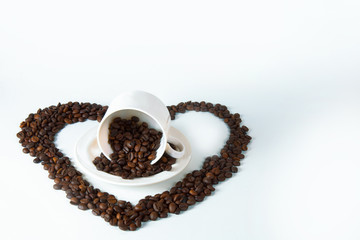 Coffee beans in the form of hearts with a cup