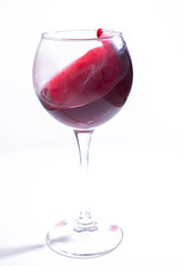 A glass with red wine on a white background. Isolate