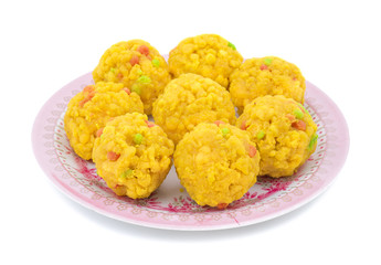 Laddu also know as laddoo, ladoo, laddo are ball-shaped sweets popular in the Indian festivals. Laddu are made of flour, minced dough and sugar with other ingredients. laddu on white background