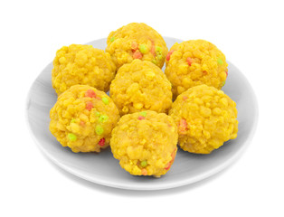 Laddu also know as laddoo, ladoo, laddo are ball-shaped sweets popular in the Indian festivals. Laddu are made of flour, minced dough and sugar with other ingredients. laddu on white background