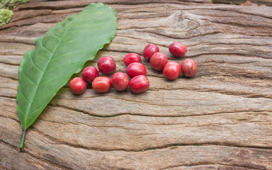 ripe coffee beans on cracked wood