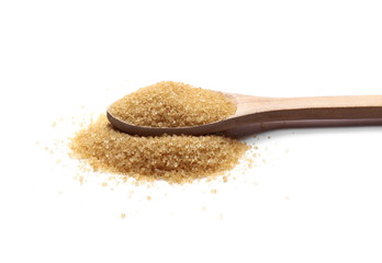 Brown cane sugar pile in wooden spoon isolated on white background, sugarcane texture