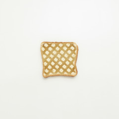 Slice of cake in a grate on a white background.