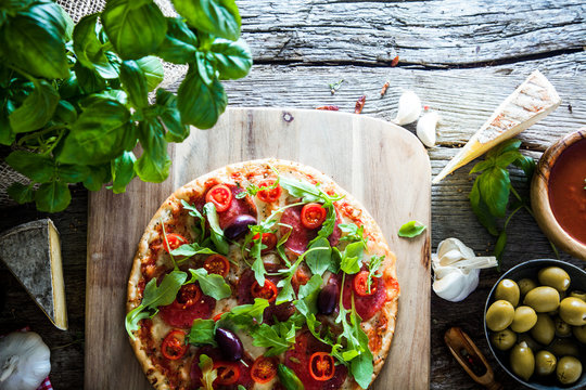 Fresh pizza on wood