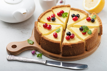 Classic cheesecake with fresh berries. - obrazy, fototapety, plakaty
