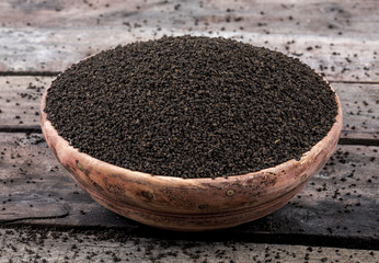 Aromatic Black Tea Loose or Dried Tea Leaves on Wooden Table