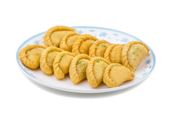 Gujiya or Gujia is a indian sweet dumpling made with suji, Maida or wheat flour and stuffed with khoya. It is common in North India, particularly in Bihar, Uttar Pradesh, Madhya Pradesh or Rajasthan