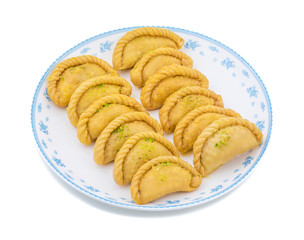 Gujiya or Gujia is a indian sweet dumpling made with suji, Maida or wheat flour and stuffed with khoya. It is common in North India, particularly in Bihar, Uttar Pradesh, Madhya Pradesh or Rajasthan