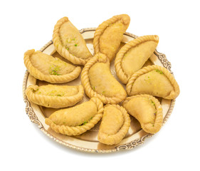 Gujiya or Gujia is a indian sweet dumpling made with suji, Maida or wheat flour and stuffed with khoya. It is common in North India, particularly in Bihar, Uttar Pradesh, Madhya Pradesh or Rajasthan
