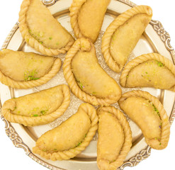 Gujiya or Gujia is a indian sweet dumpling made with suji, Maida or wheat flour and stuffed with khoya. It is common in North India, particularly in Bihar, Uttar Pradesh, Madhya Pradesh or Rajasthan