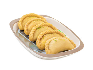 Gujiya or Gujia is a indian sweet dumpling made with suji, Maida or wheat flour and stuffed with khoya. It is common in North India, particularly in Bihar, Uttar Pradesh, Madhya Pradesh or Rajasthan
