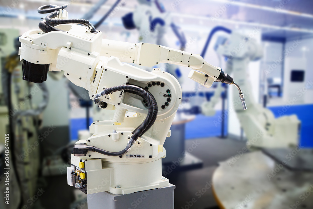 Aufkleber A robotic arm. Automatic welding robot in a modern factory.