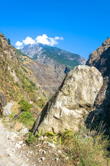 Mountain landscape with a deep gorge in the Himalayas.