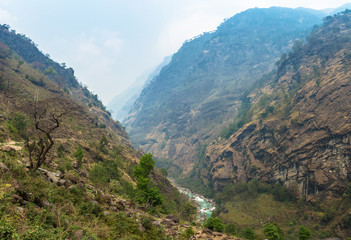 Fototapeta premium Mountain river in a deep gorge in the Himalayas.