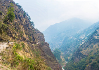 Mountain landscape with a deep gorge in the Himalayas.