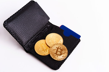 Virtual currency wallet. Bitcoin gold coin and printed encrypted money. Cryptocurrency concept on...