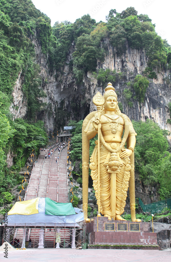 Poster lord murugan statue and entrance in batu caves, kuala lumpur, malaysia