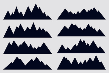 Mountain silhouettes on white background. Set of geometric mountain ridges. Vector black icons. Outdoor design elements.