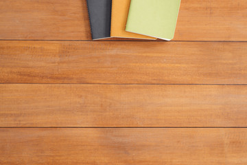 Minimal work space - Creative flat lay photo of workspace desk. Office desk wooden table background with mock up notebooks. Top view with copy space, flat lay photography.