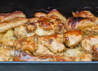 Grilled chicken with potatoes on the plate