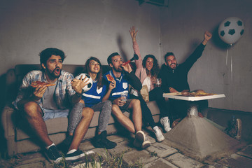 Watching a football match © Impact Photography
