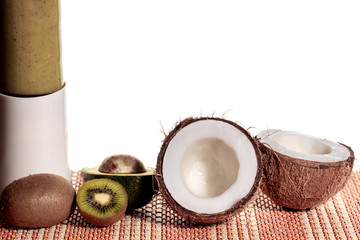 Freshly blended green fruit smoothie . White background, copy space.