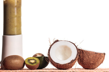 Freshly blended green fruit smoothie . White background, copy space.