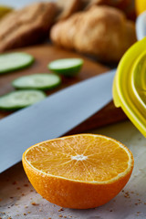 Fresh ripe orange halves on light grey background, selective focus