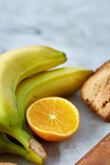 Fresh ripe orange halves on light grey background, selective focus