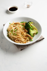 Asian udon noodles with chicken and broccoli