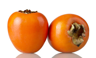 Two ripe persimmon fruits isolated on white
