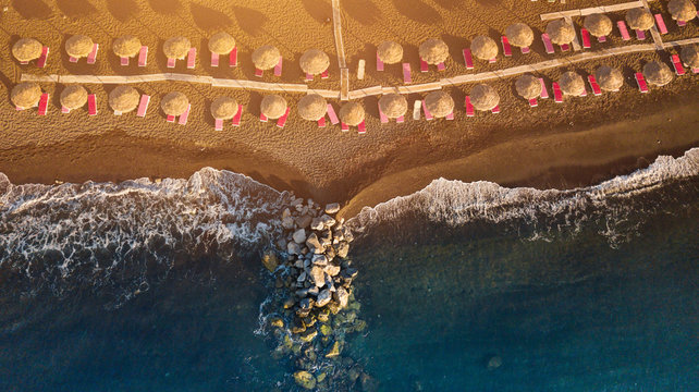 Perissa beach during sunrise on the Greek island of Santorini.