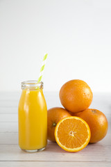 Orange Fruit Smoothy on a White Wood Table
